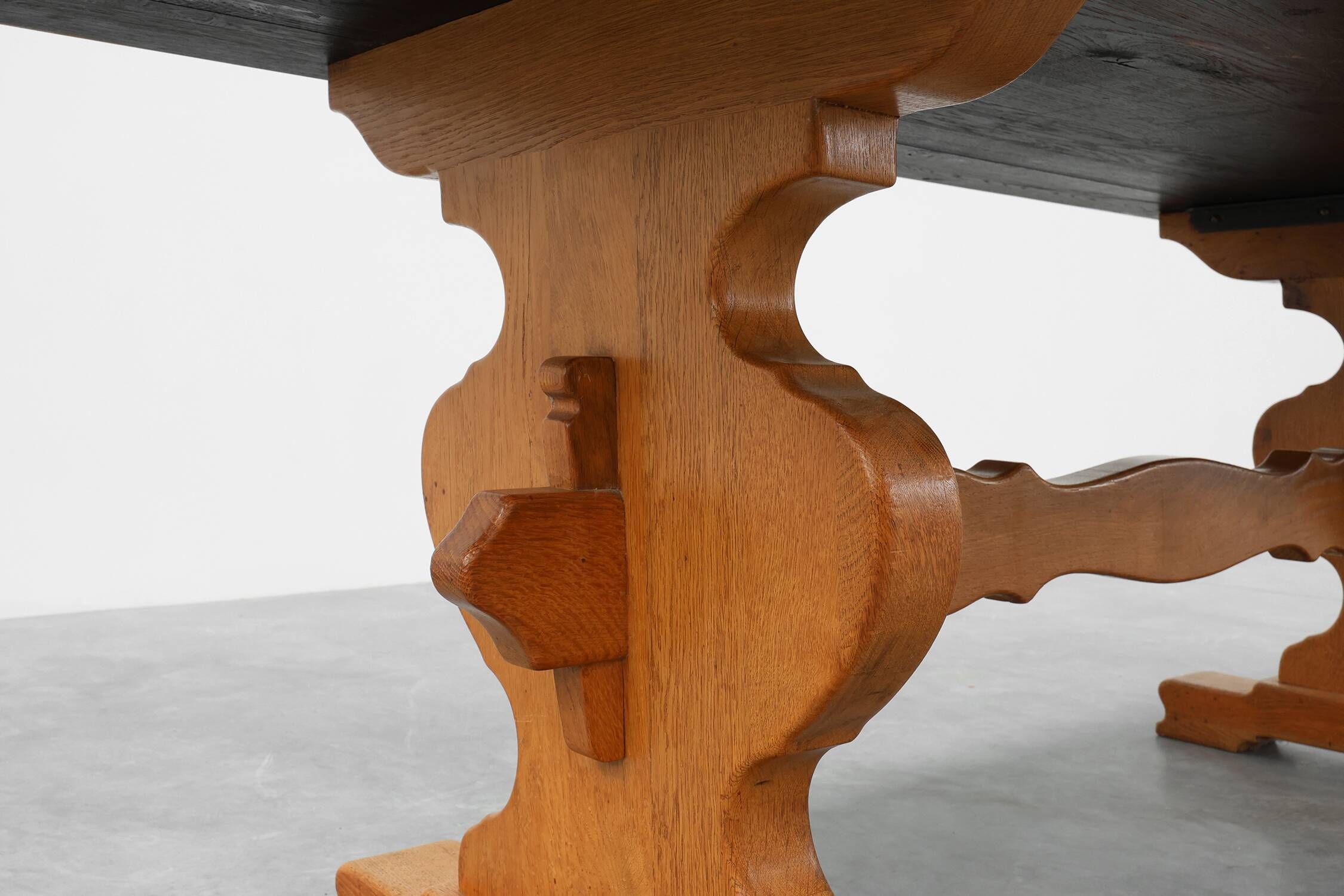 20th Century French oak trestle table with scalloped legs and plank top