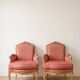 Pair of Louis XV cabriolet armchairs in wood and pink fabric.
