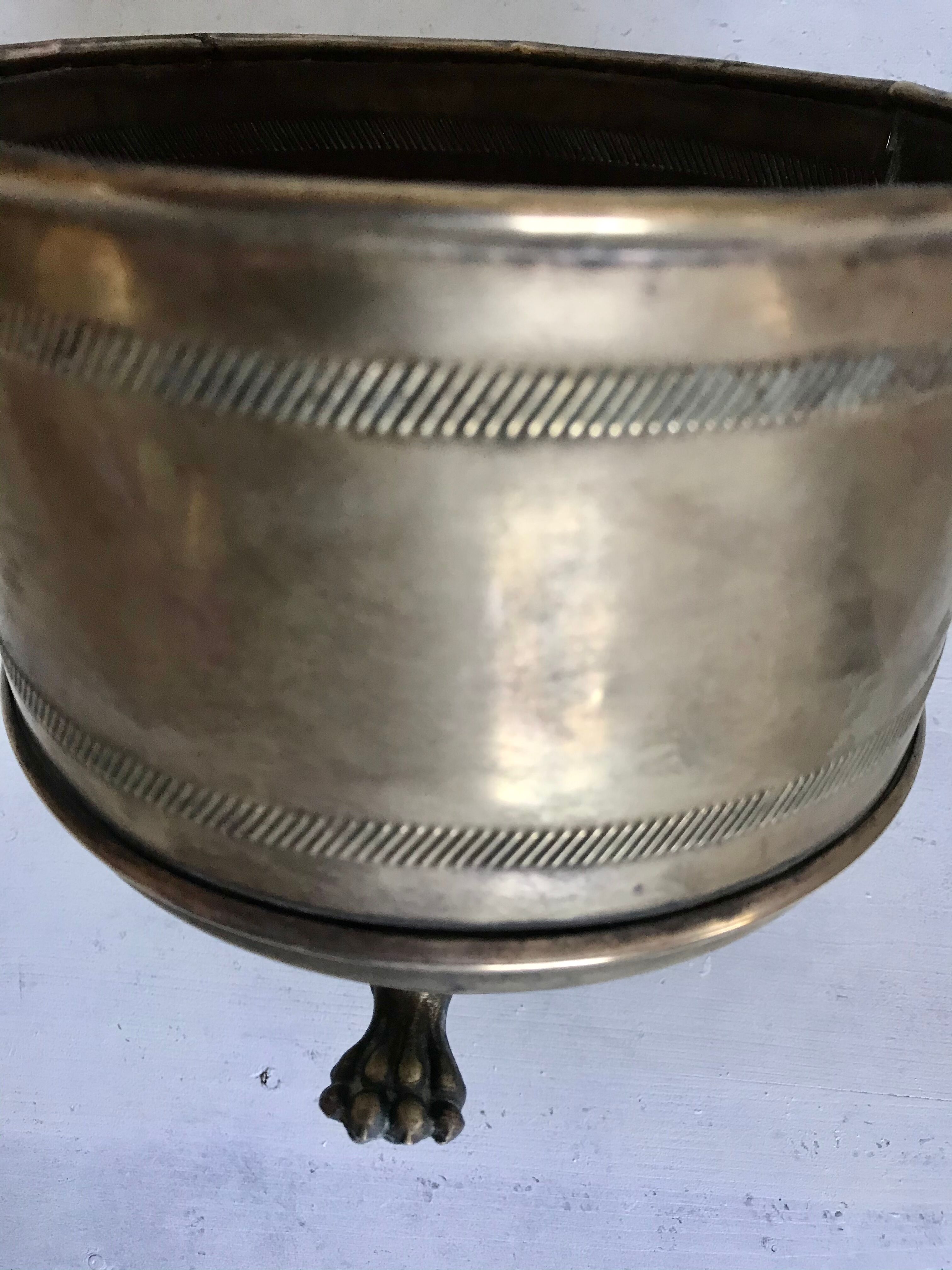 Former brass tripod pot