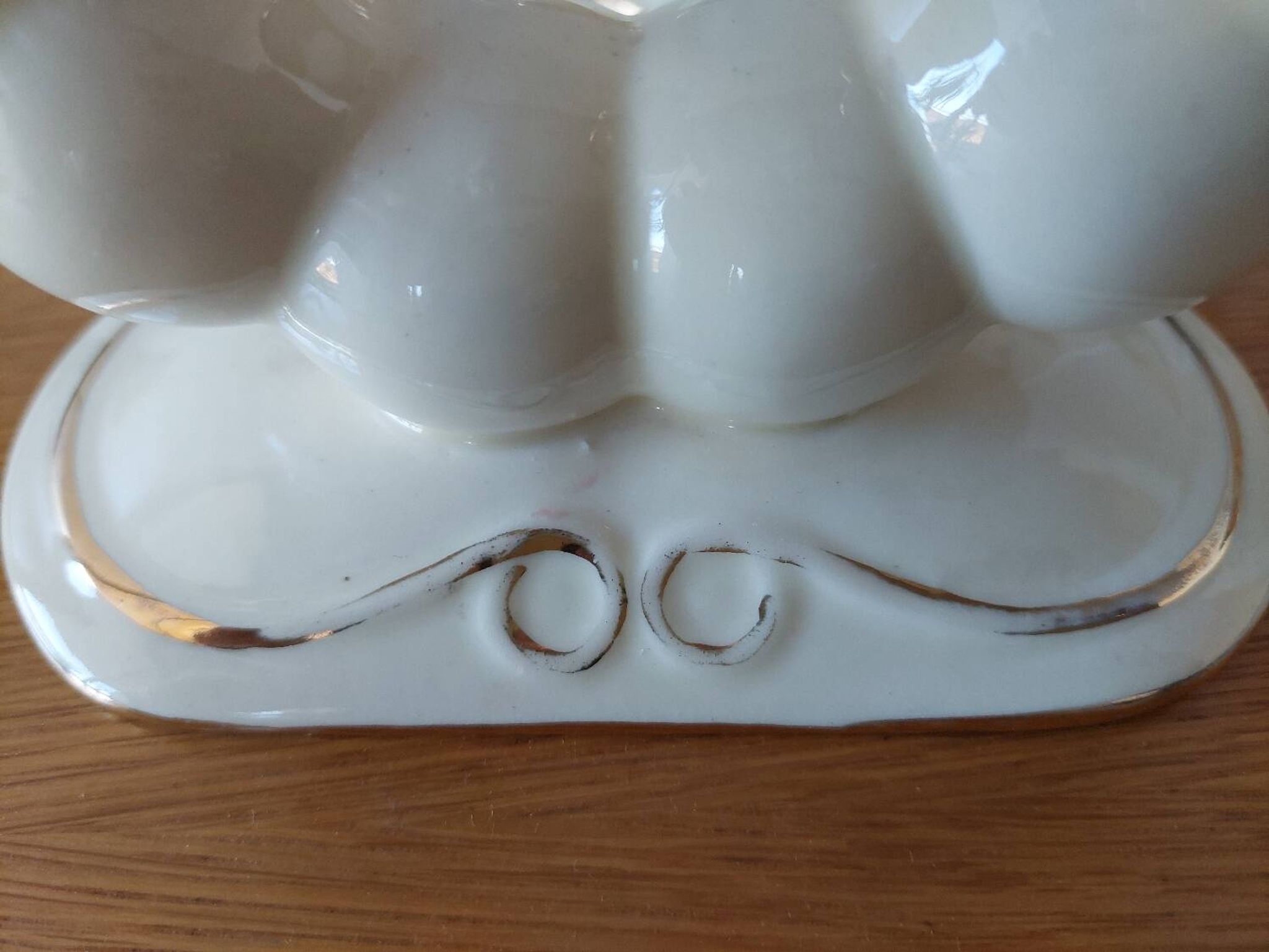 Pair of cream ceramic candlesticks with gold trim circa 1930-1950