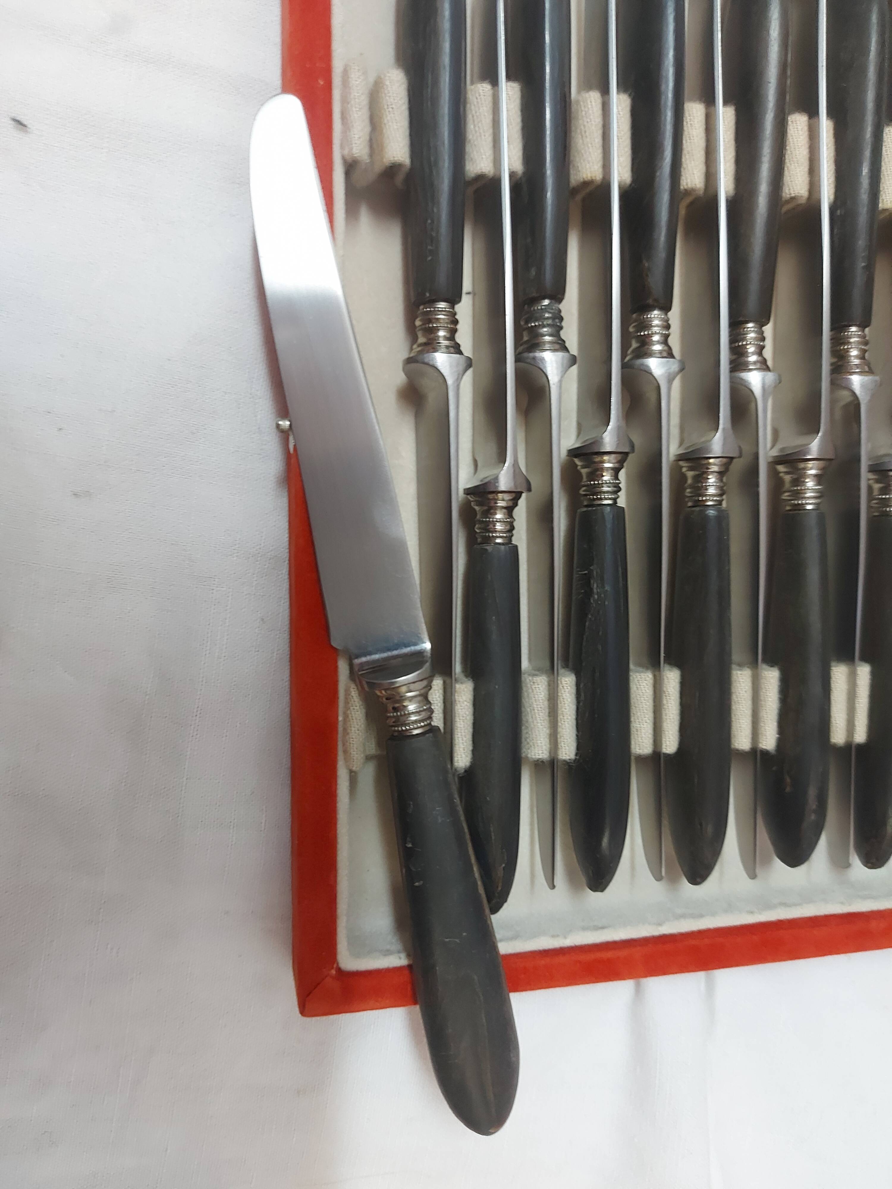 12 ebony handled knives, 1950