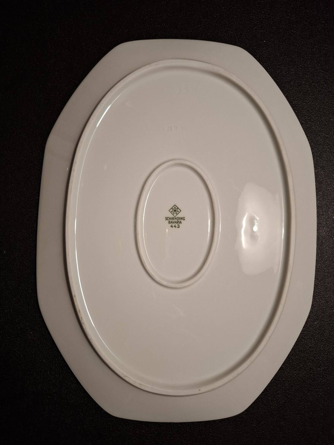 Dishes and porcelain sauceboat