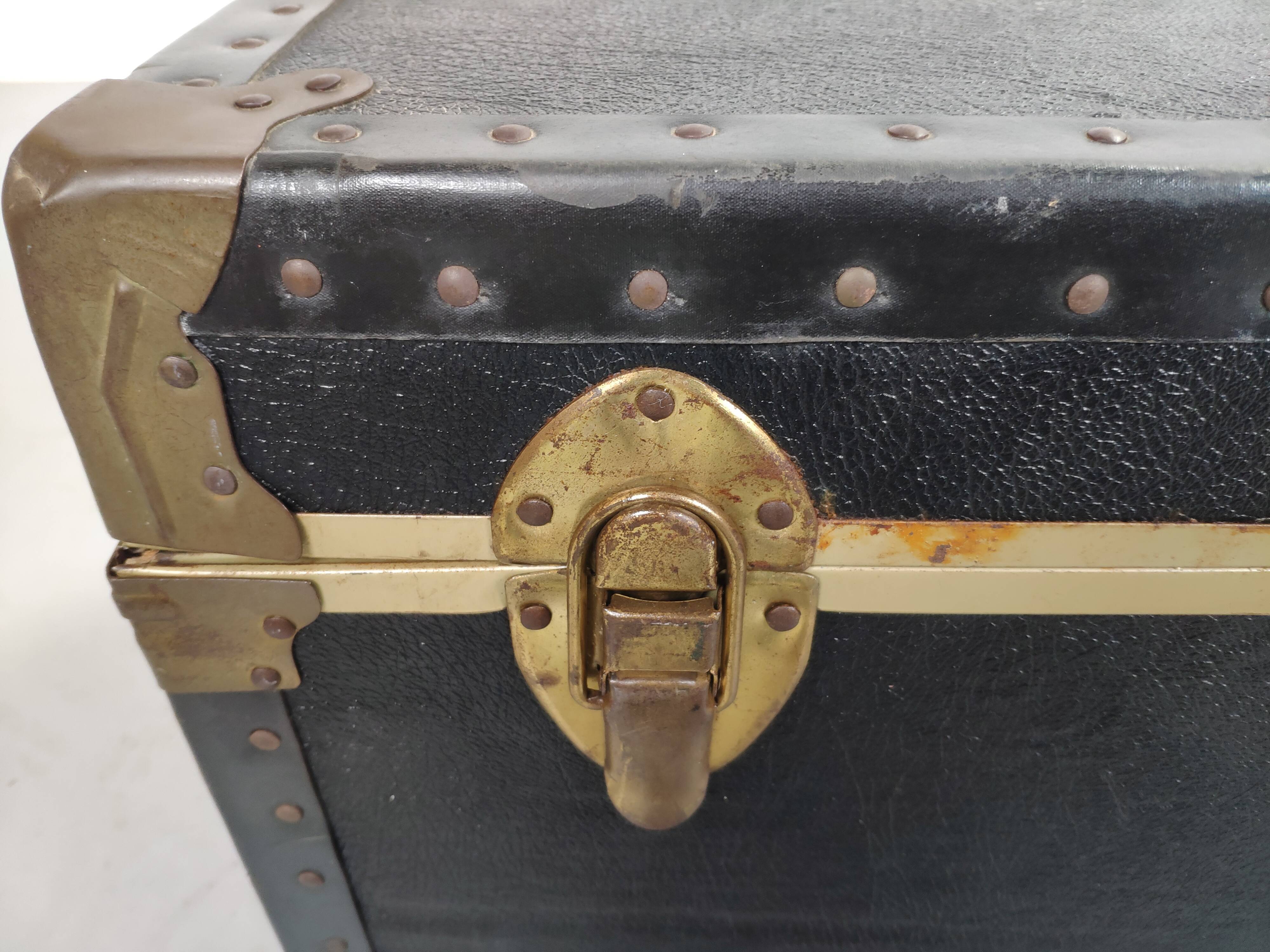 Old black trunk and brass