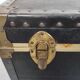 Old black trunk and brass