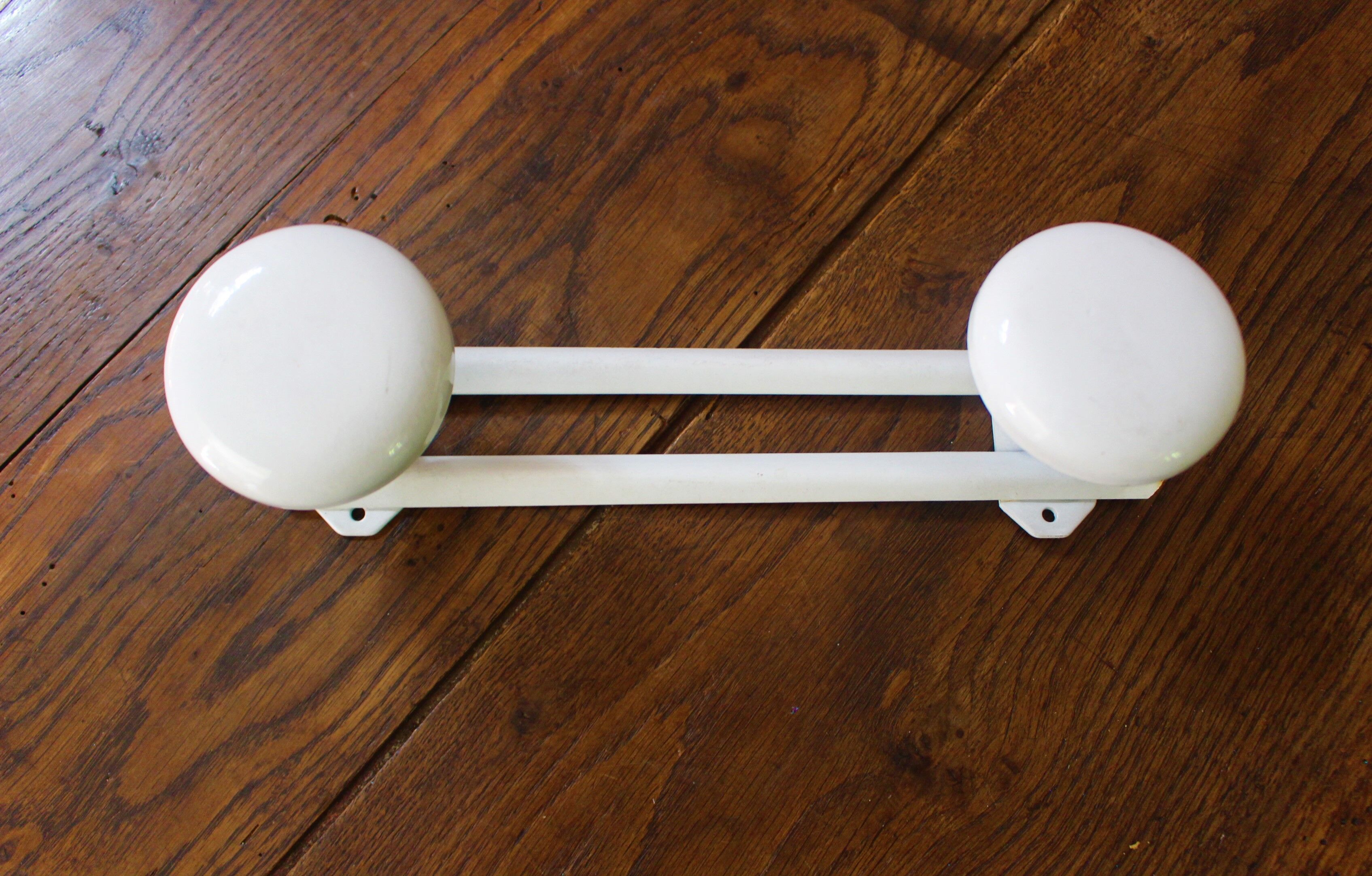 Vintage white metal coat rack with 2 hooks