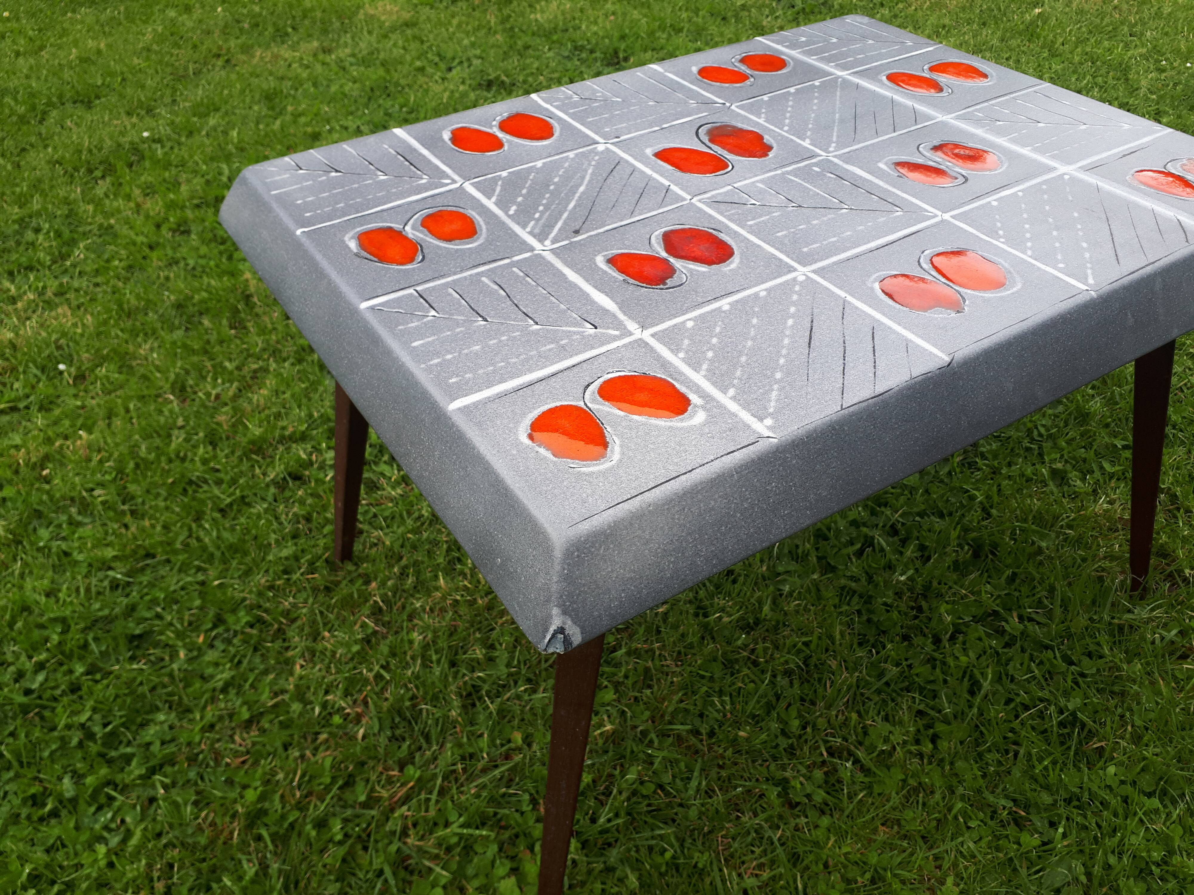 Small 1960s enamelled table, spindle legs, signed jd.