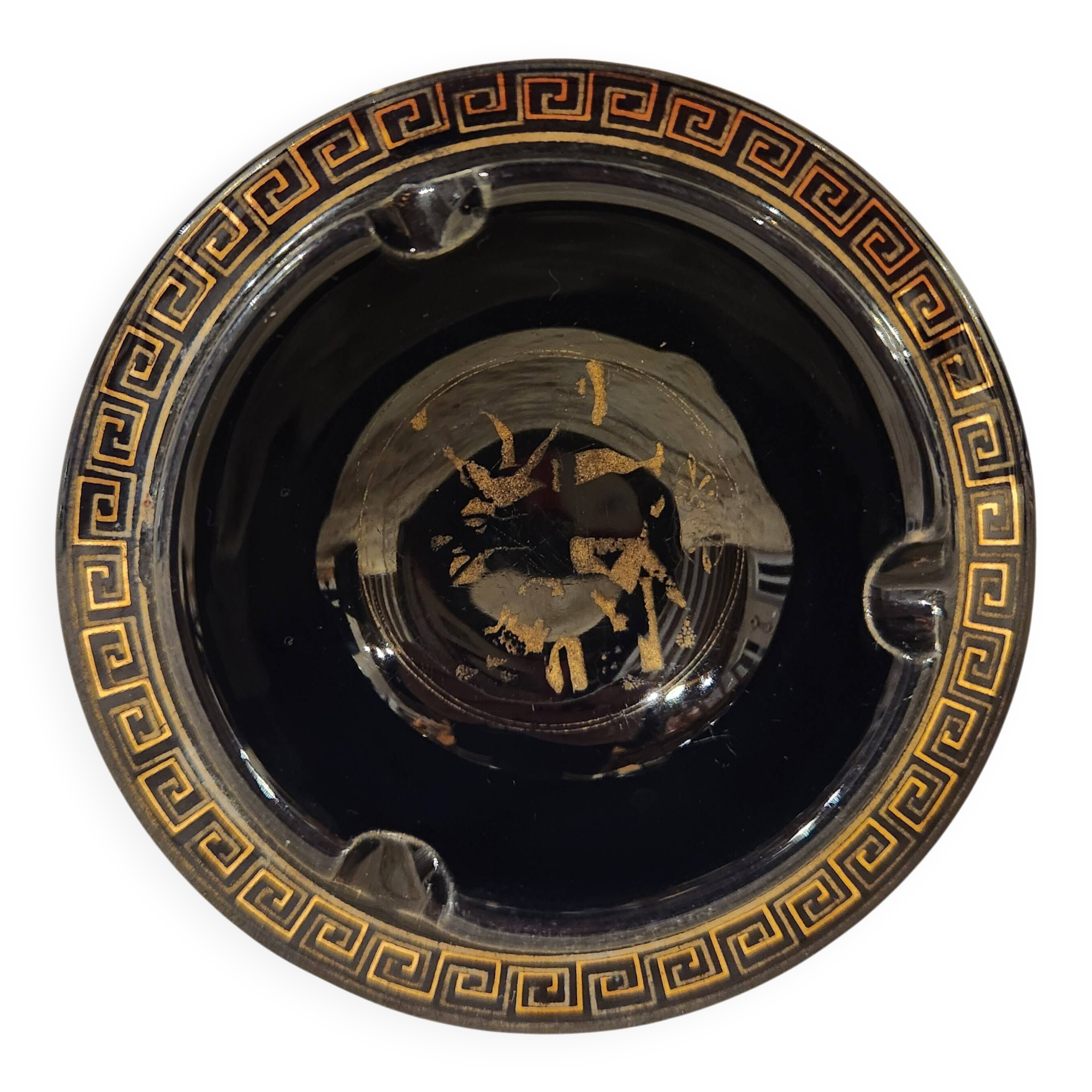 Small vintage ashtray in black ceramic with gold decoration in Greek style.