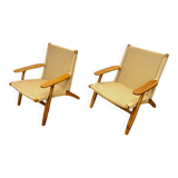 Pair of Scandinavian armchairs in woven solid teak.