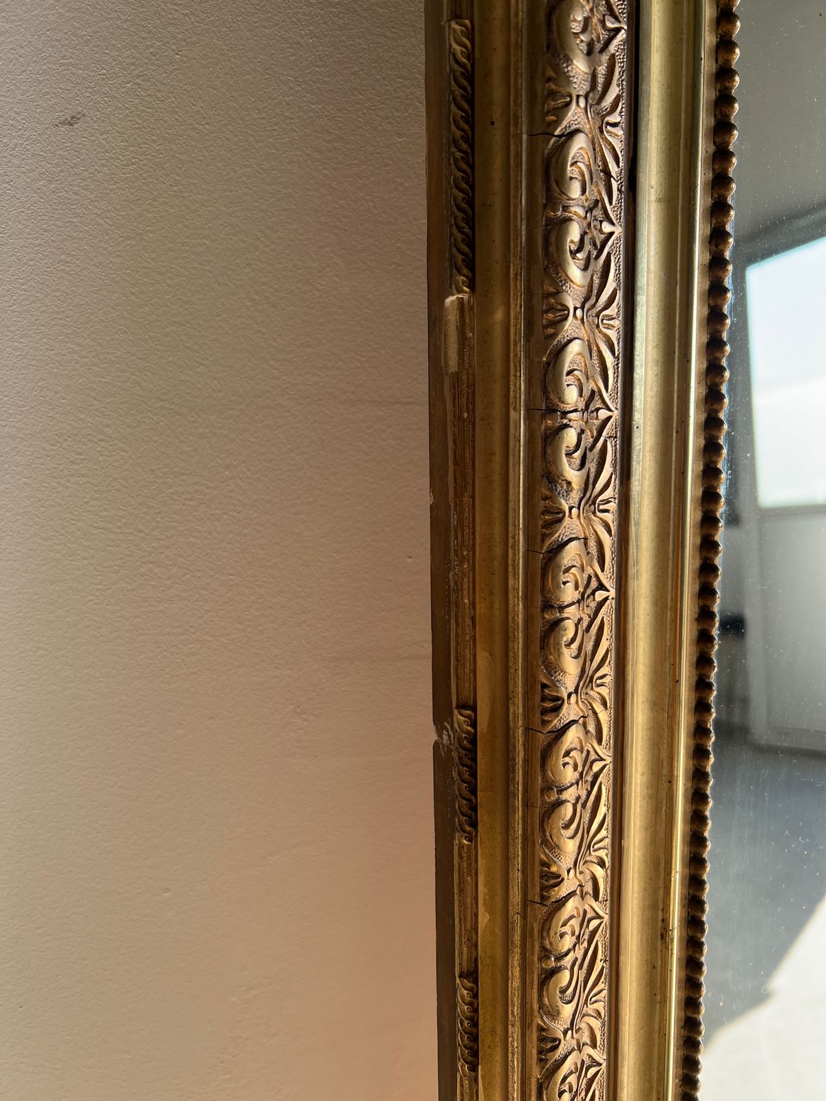 Gilded mirror with frieze h2m10 l:73cm