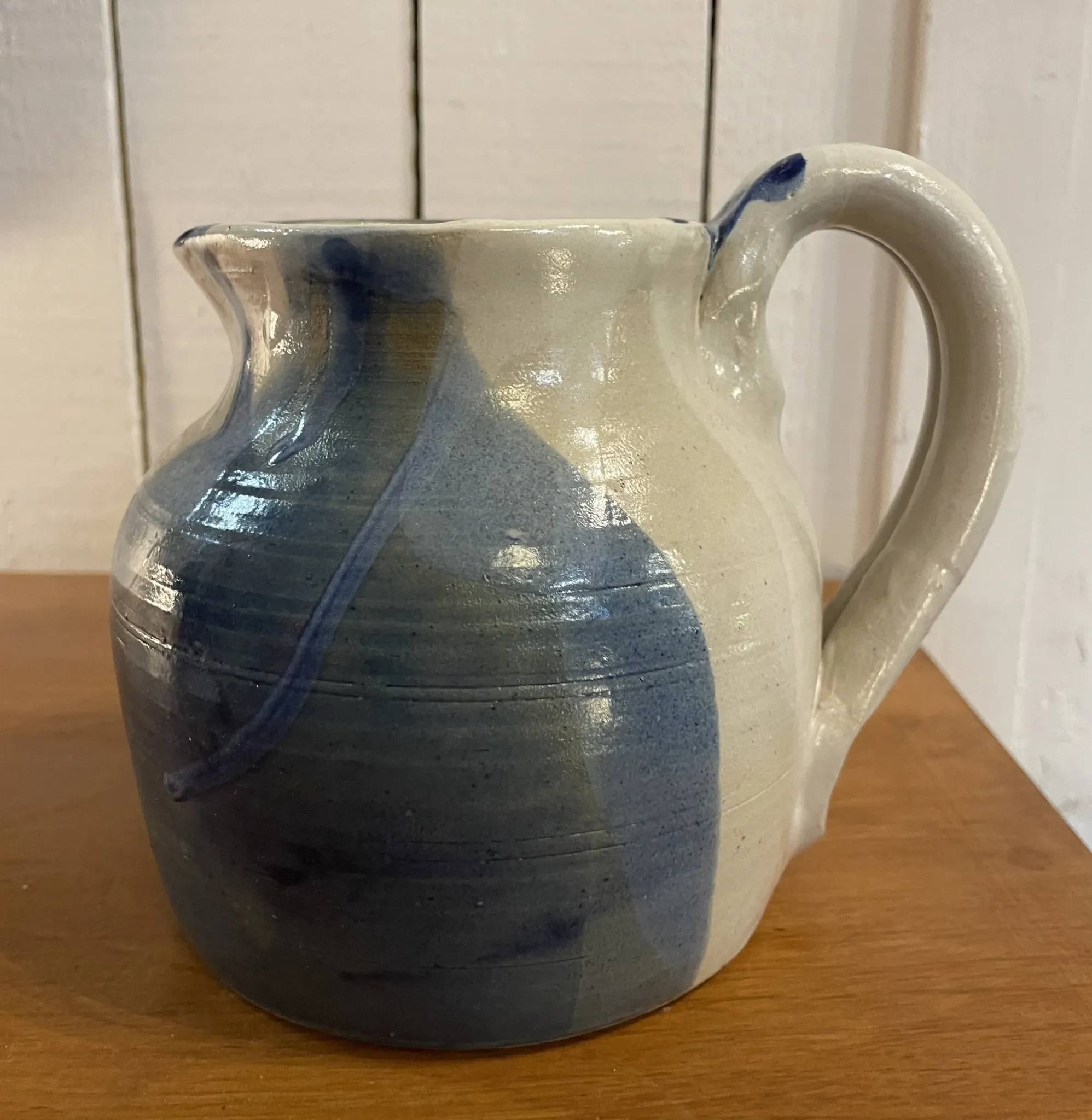 Beige and blue stoneware jug