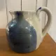 Beige and blue stoneware jug