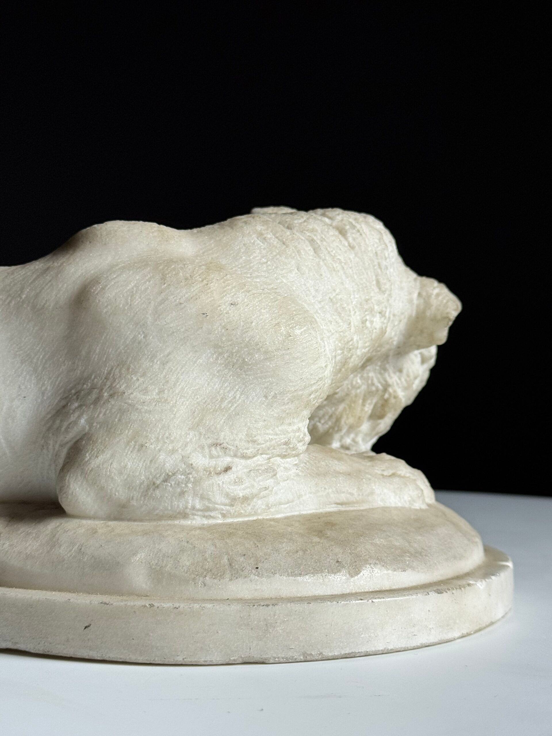 Marble sculpture of a reclining lion