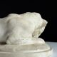 Marble sculpture of a reclining lion