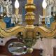Golden wooden chandelier with crystal pendants from the 19th century.