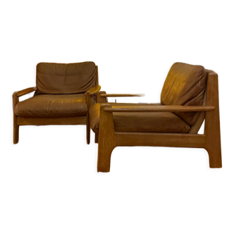 Paire de fauteuils danois des années 70 en cuir et chêne massif