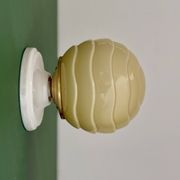 Vintage Art Deco globe wall light in pale yellow opaline.
