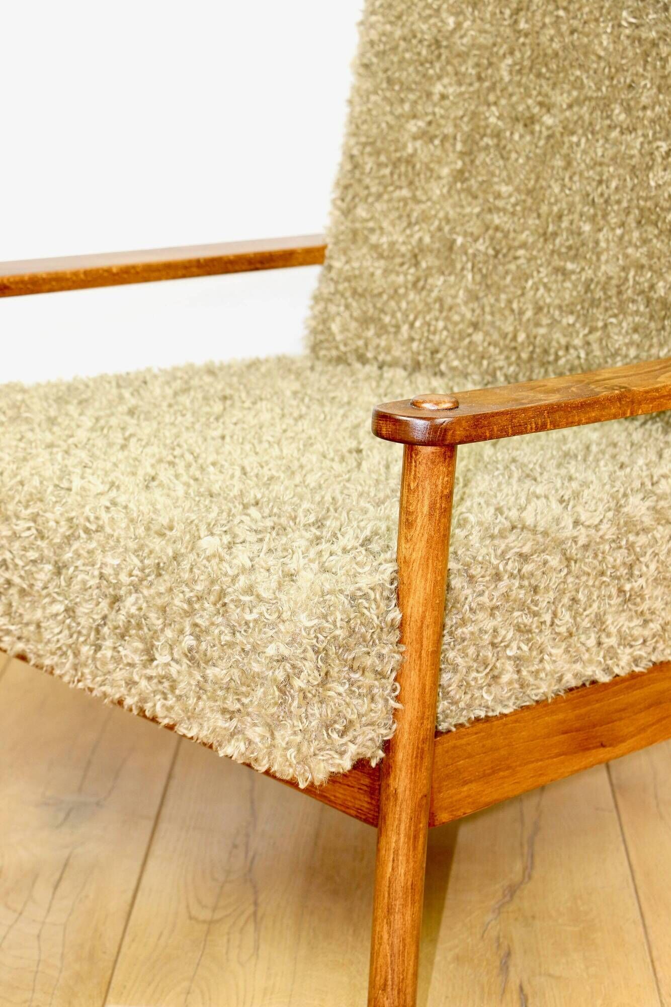 Wooden vintage brown armchair, olive green, long pile on removable cushions