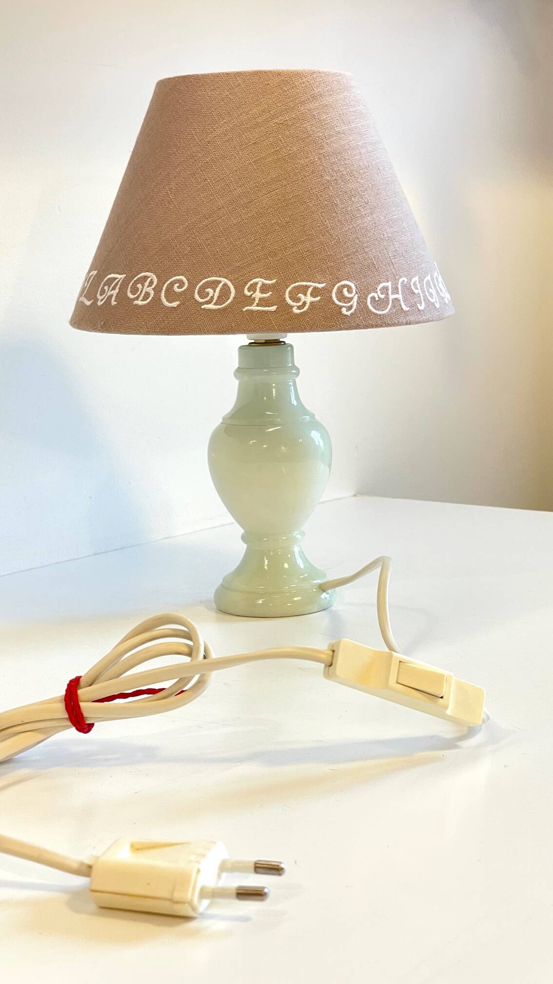 White marble lamp and vintage linen