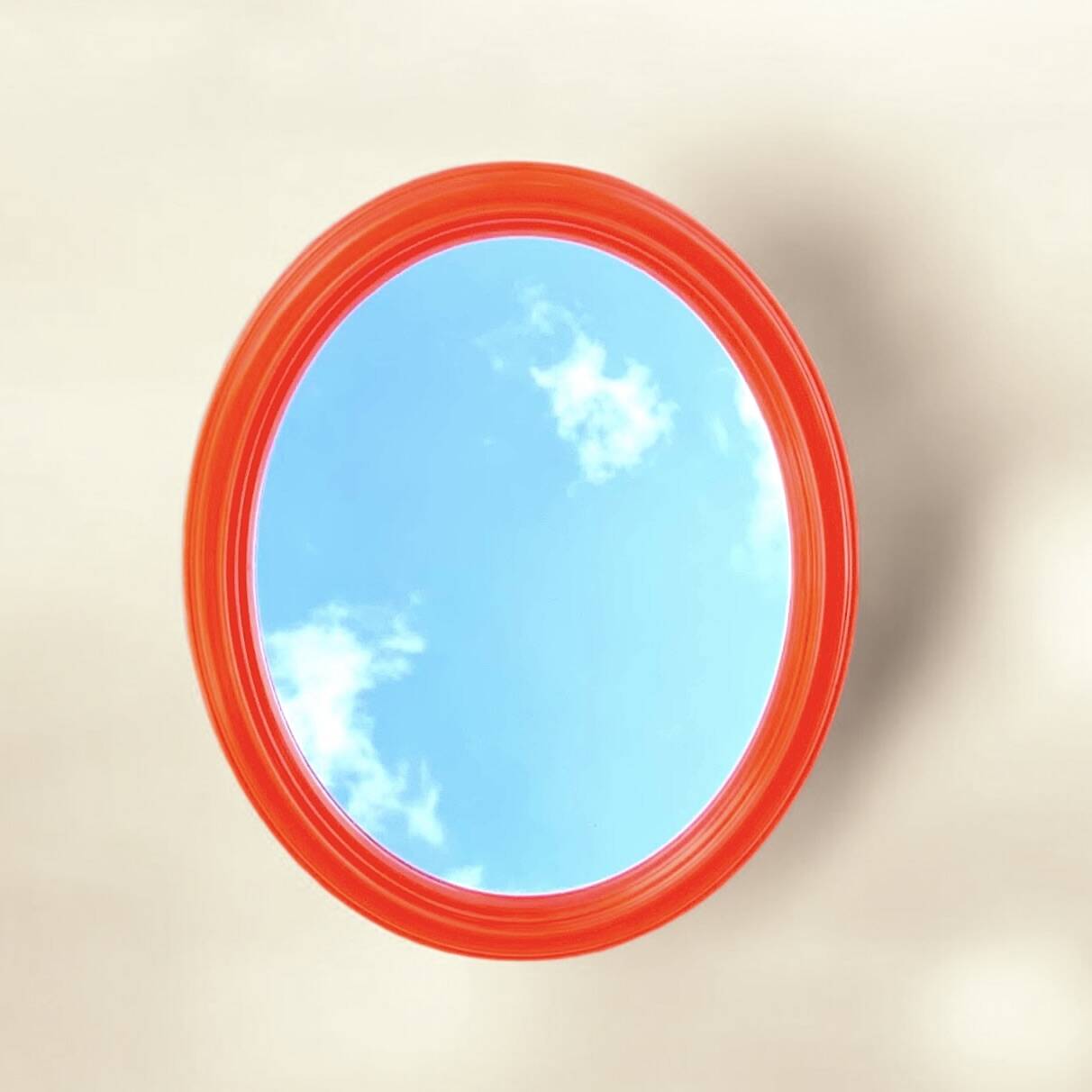 Vintage orange plastic oval wall mirror