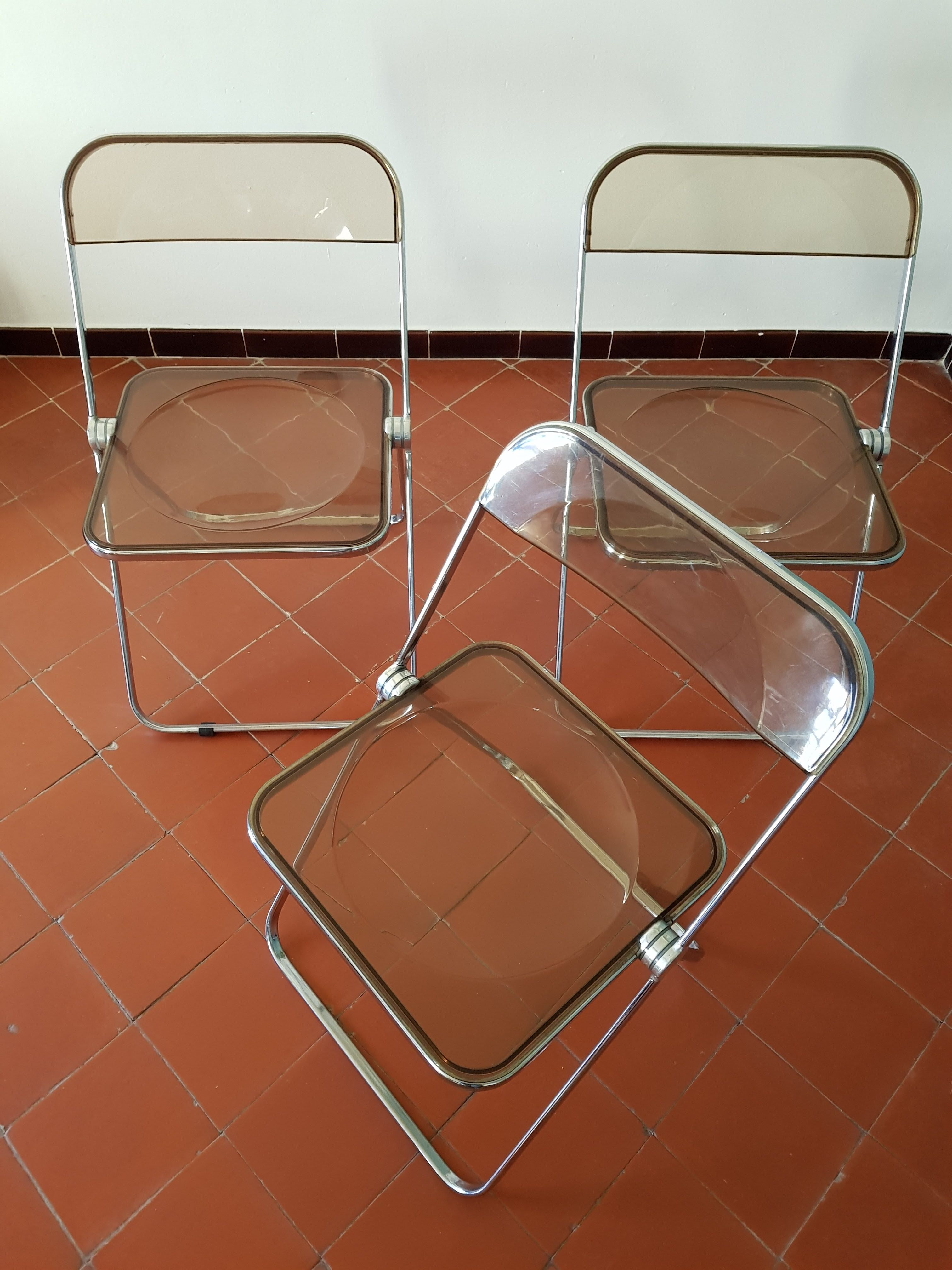 Trio of chairs folded Castelli design Giancarlo company