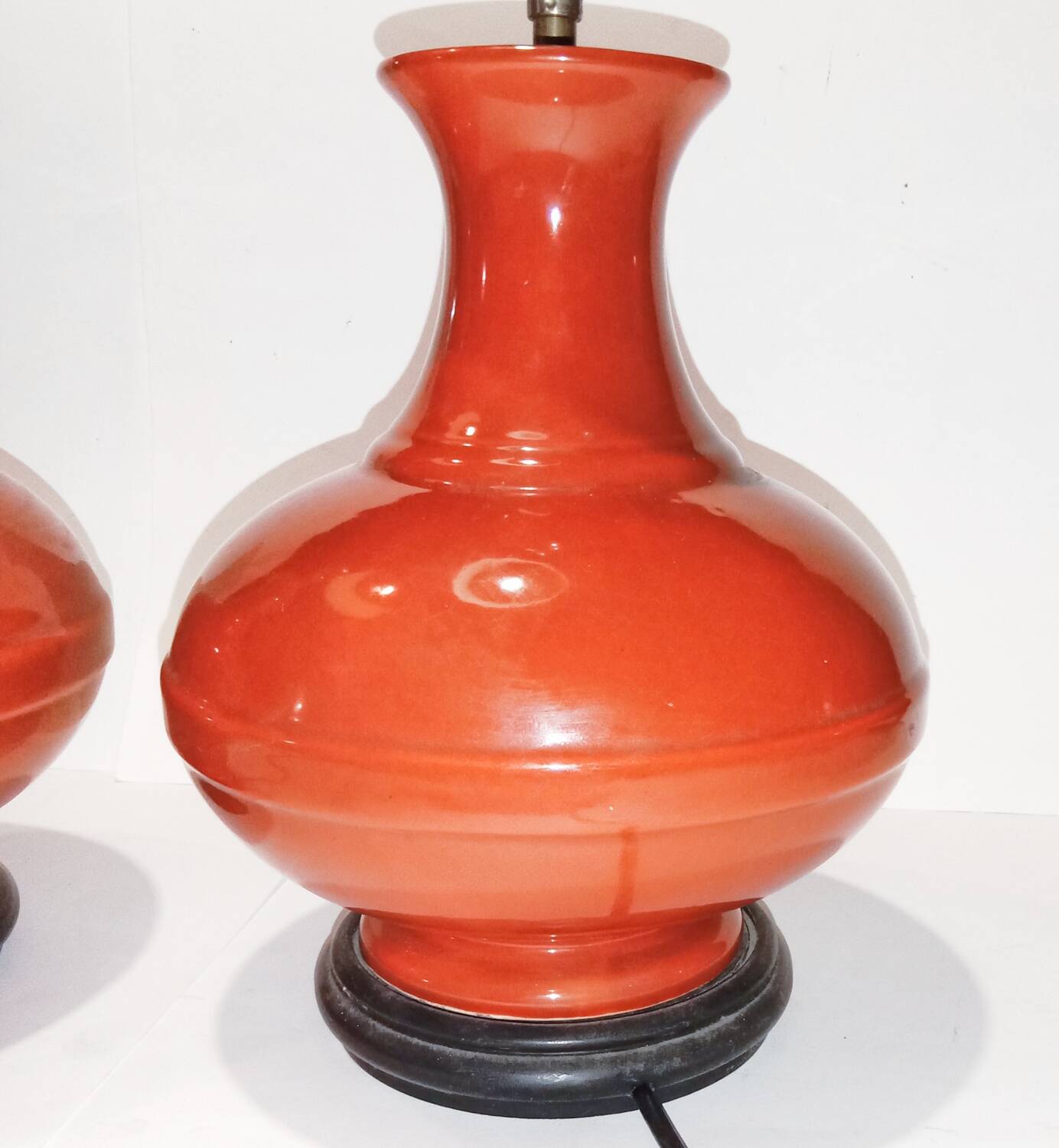 Pair of ceramic lamp bases in the shape of orange gourds.