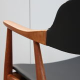 Vintage armchair in teak and black leather model Casina 60s