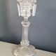 Old candlestick with molded glass stamps
