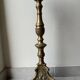 Gilded bronze candlestick with cherub trio decoration