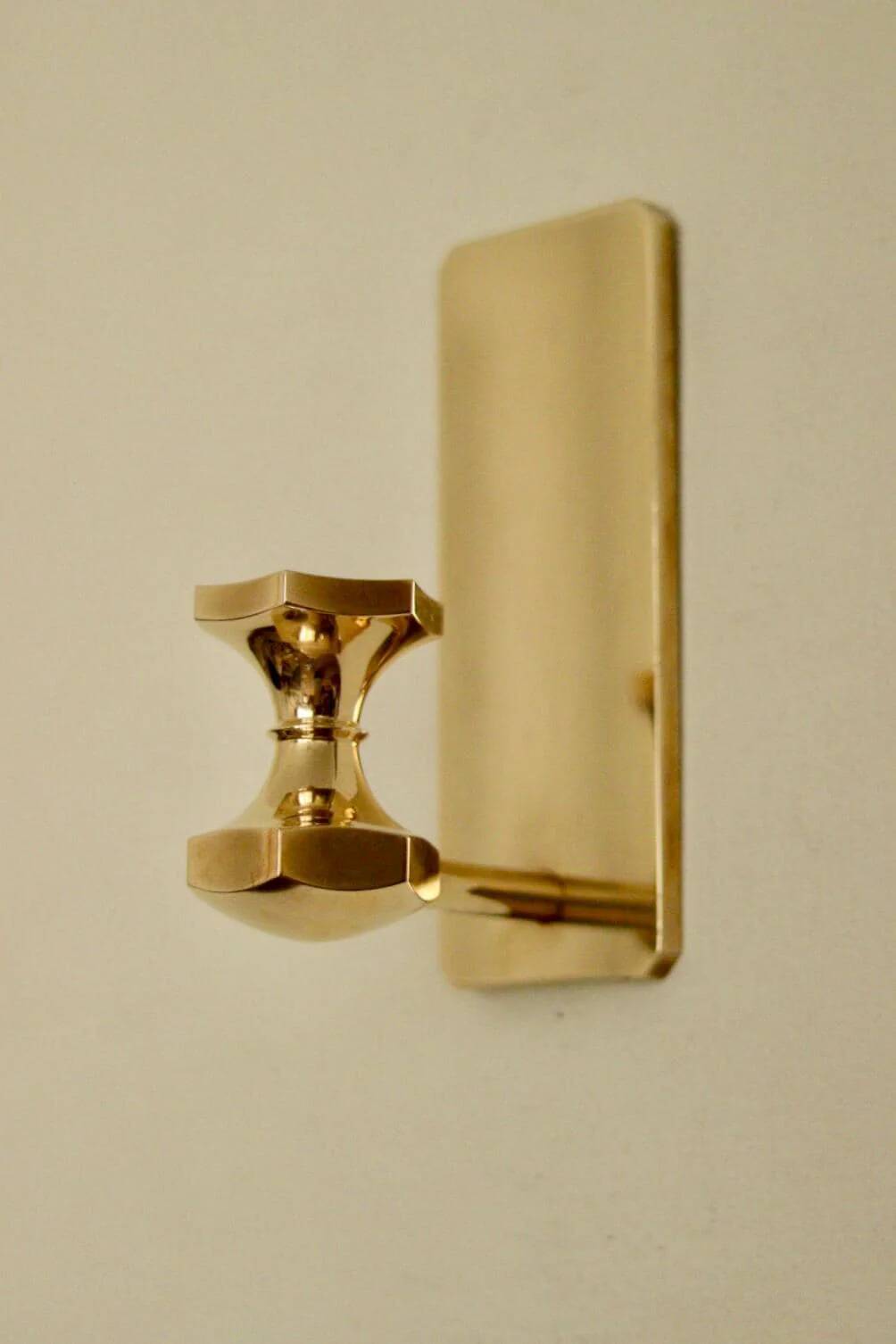 1988, single mid-century Swedish brass sconce by Gusum