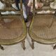 Paire de chaises de musiciens en bois sculpté et doré de style Louis XVI