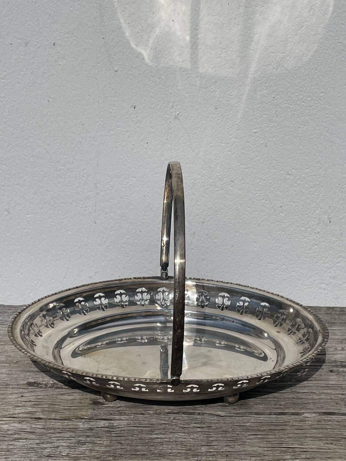Oval dish with silver-plated metal handle