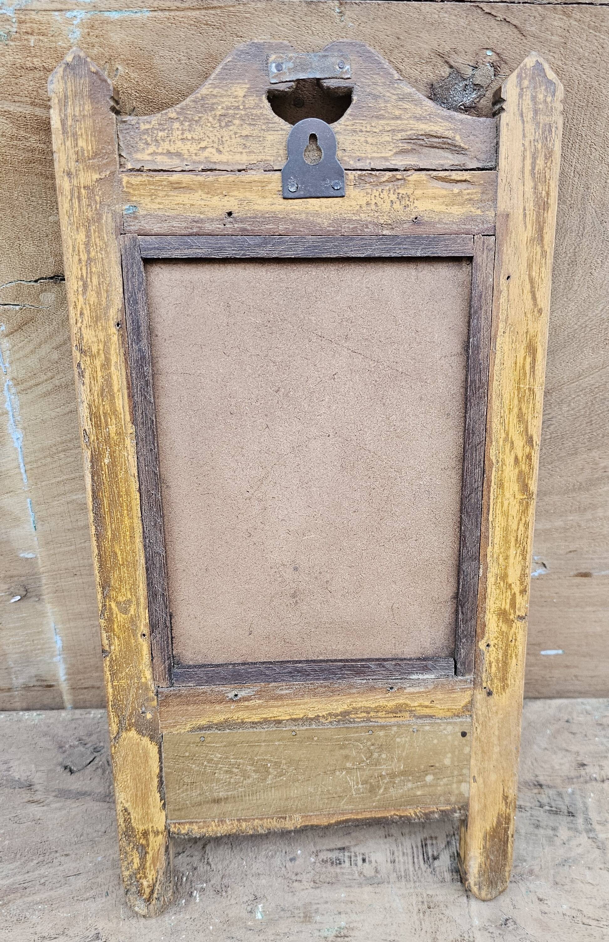 Antique barber's mirror in Burmese teak.