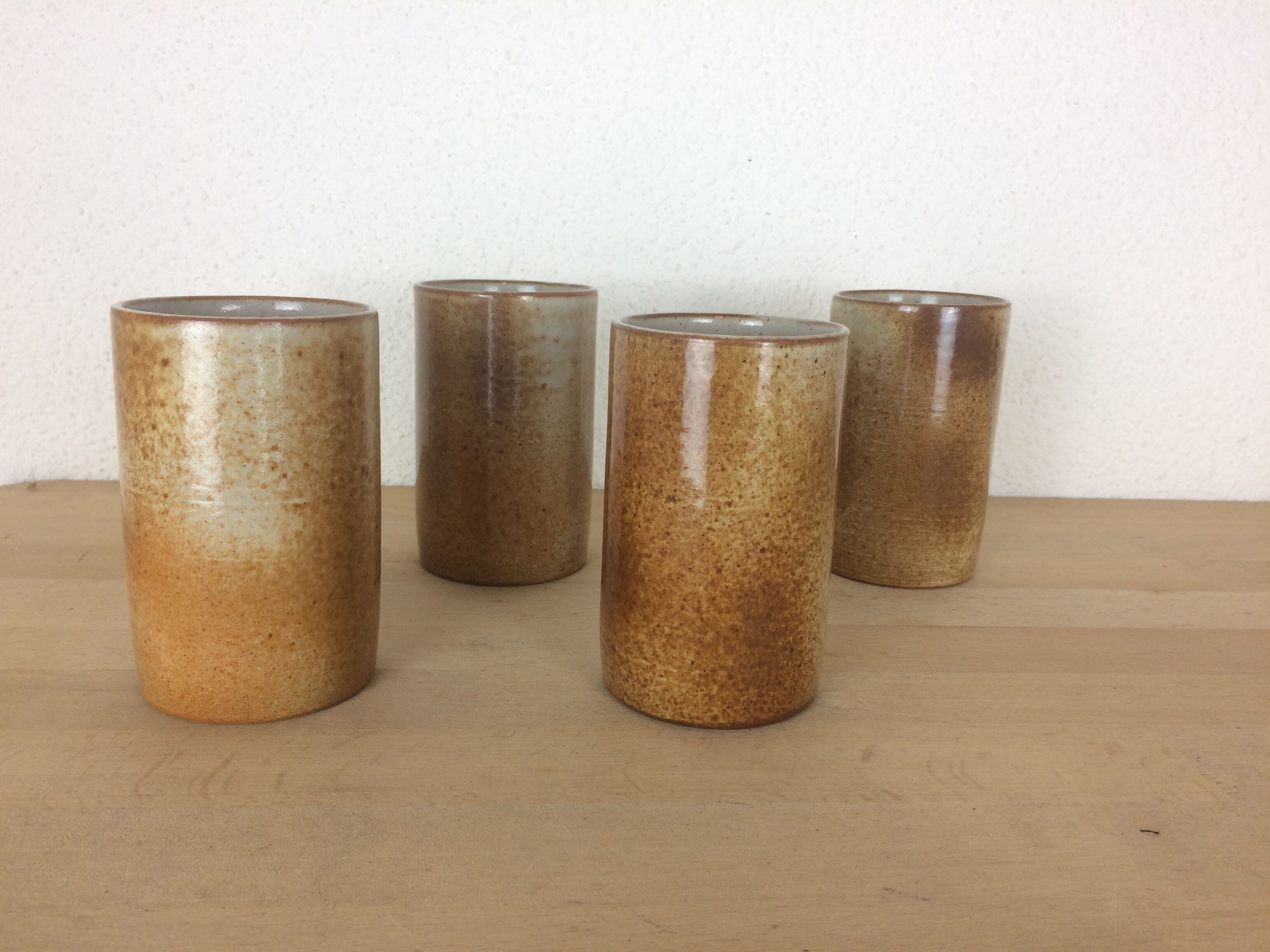 4 signed sandstone cup glasses