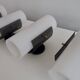 Set of four wall lights in white plexiglass and perforated black metal.