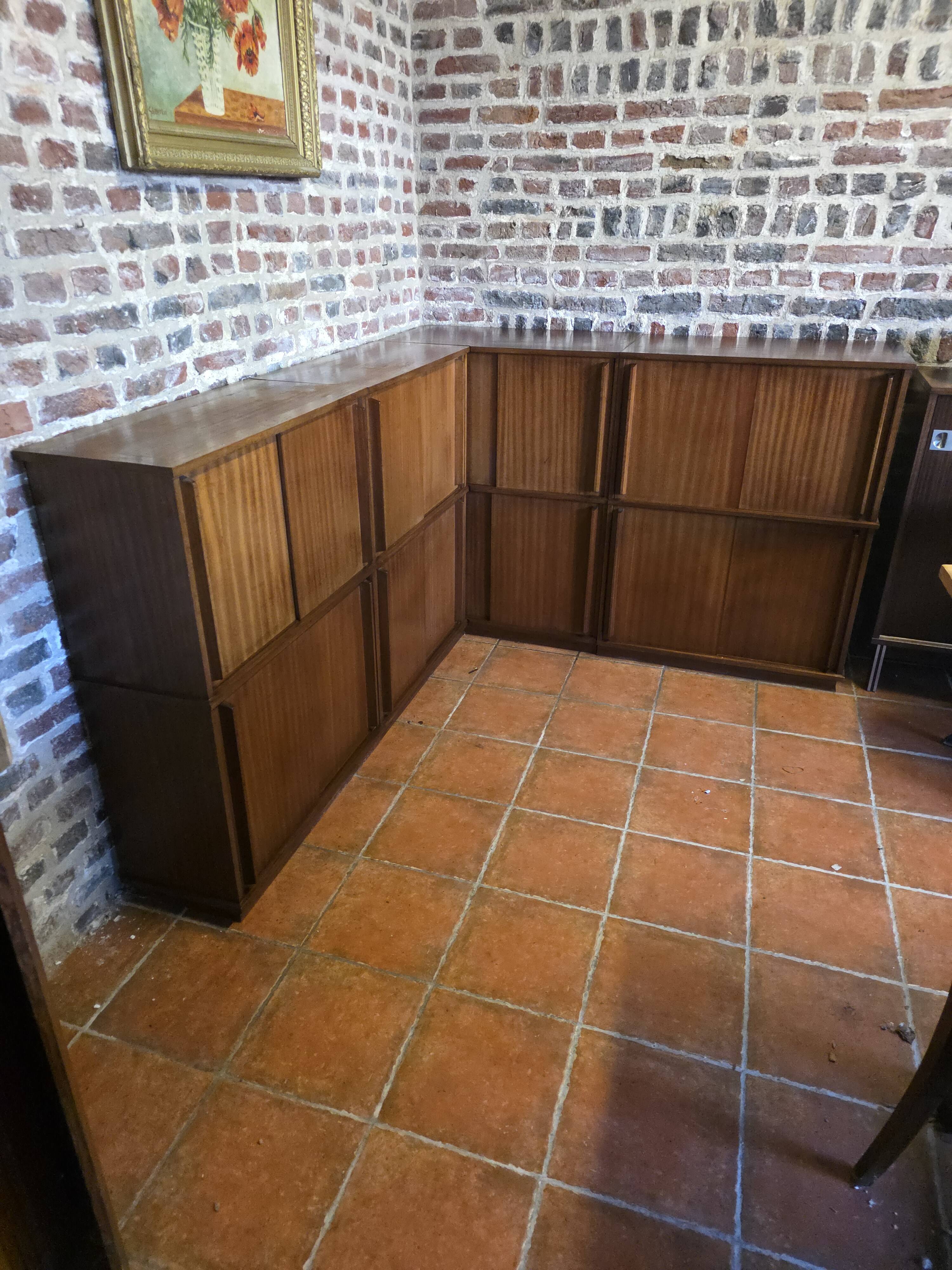 Modular corner library Oscar from the 1960s with sliding doors.