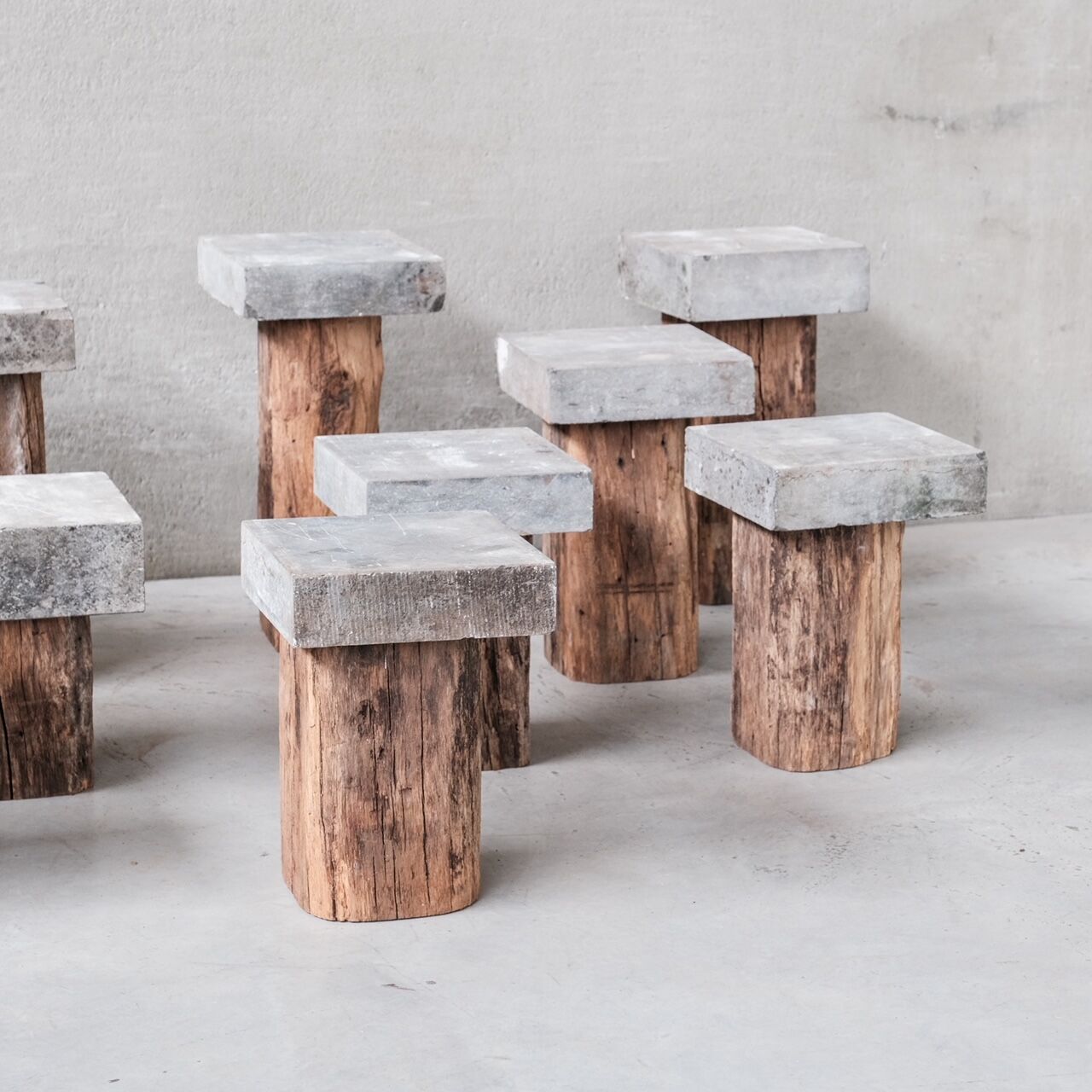 Wooden and stone mid-century pedestals or side tables