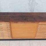 Workshop furniture with drawers and curtain in beech and walnut.