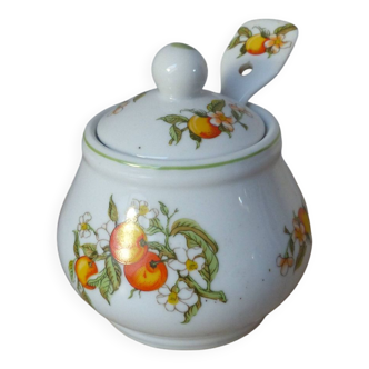 Old ceramic sugar bowl with spoon decorated with apricot fruits, small tableware decoration