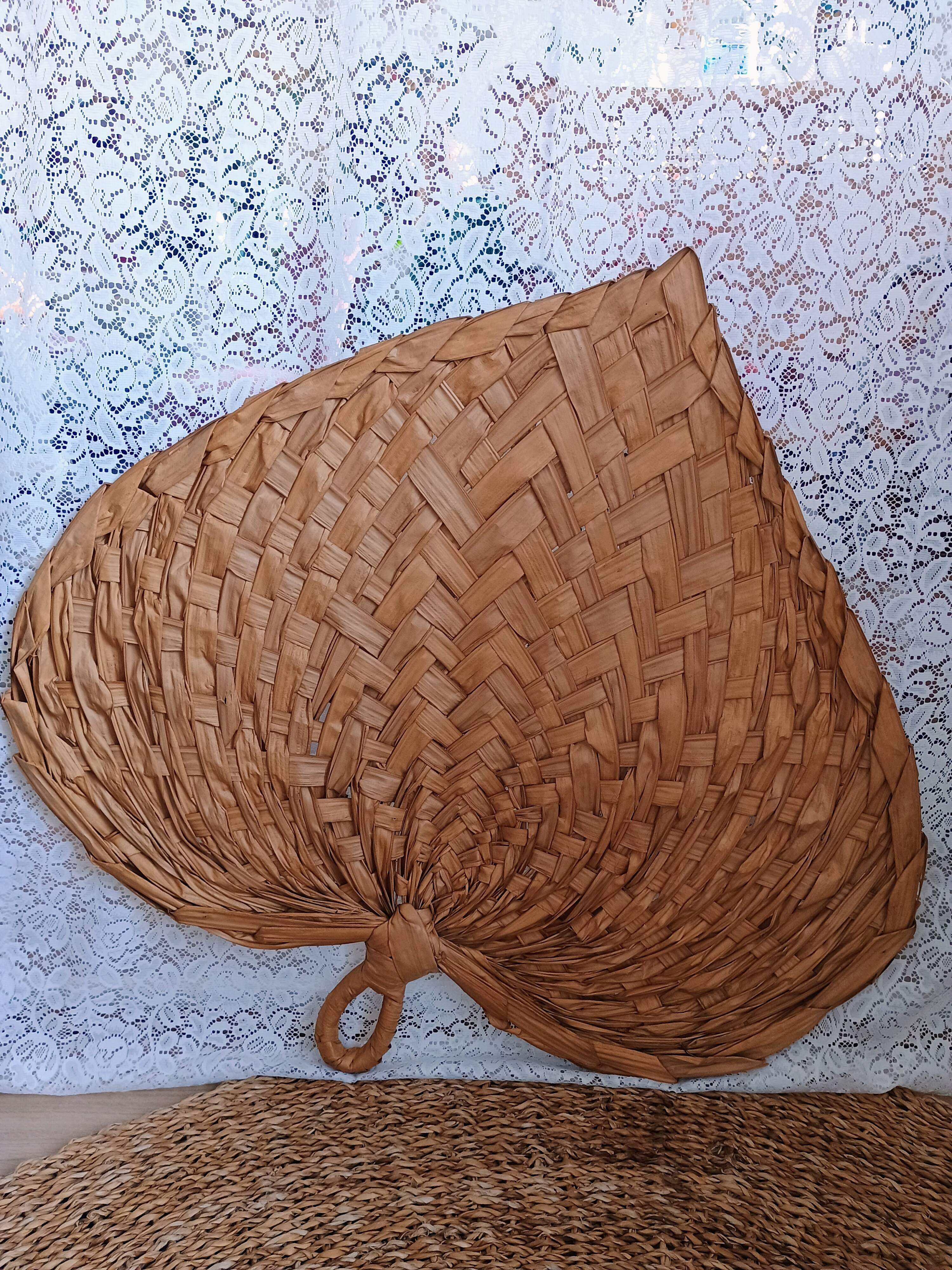 Heart fan in vintage woven palm leaves