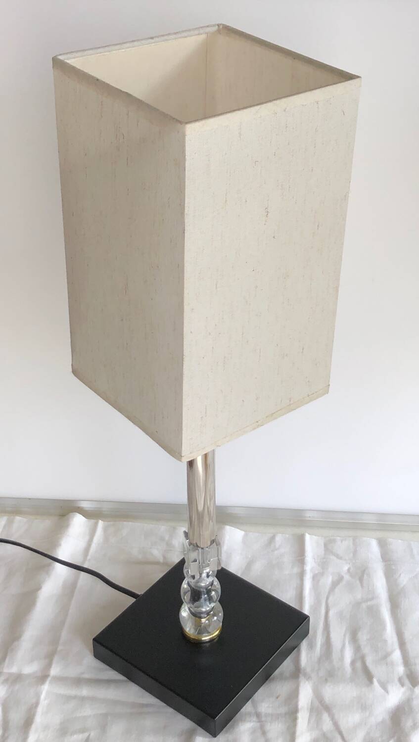 Silver floor lamp with a straight shade.