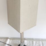Silver floor lamp with a straight shade.