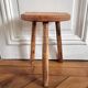 Tripod stool in raw wood