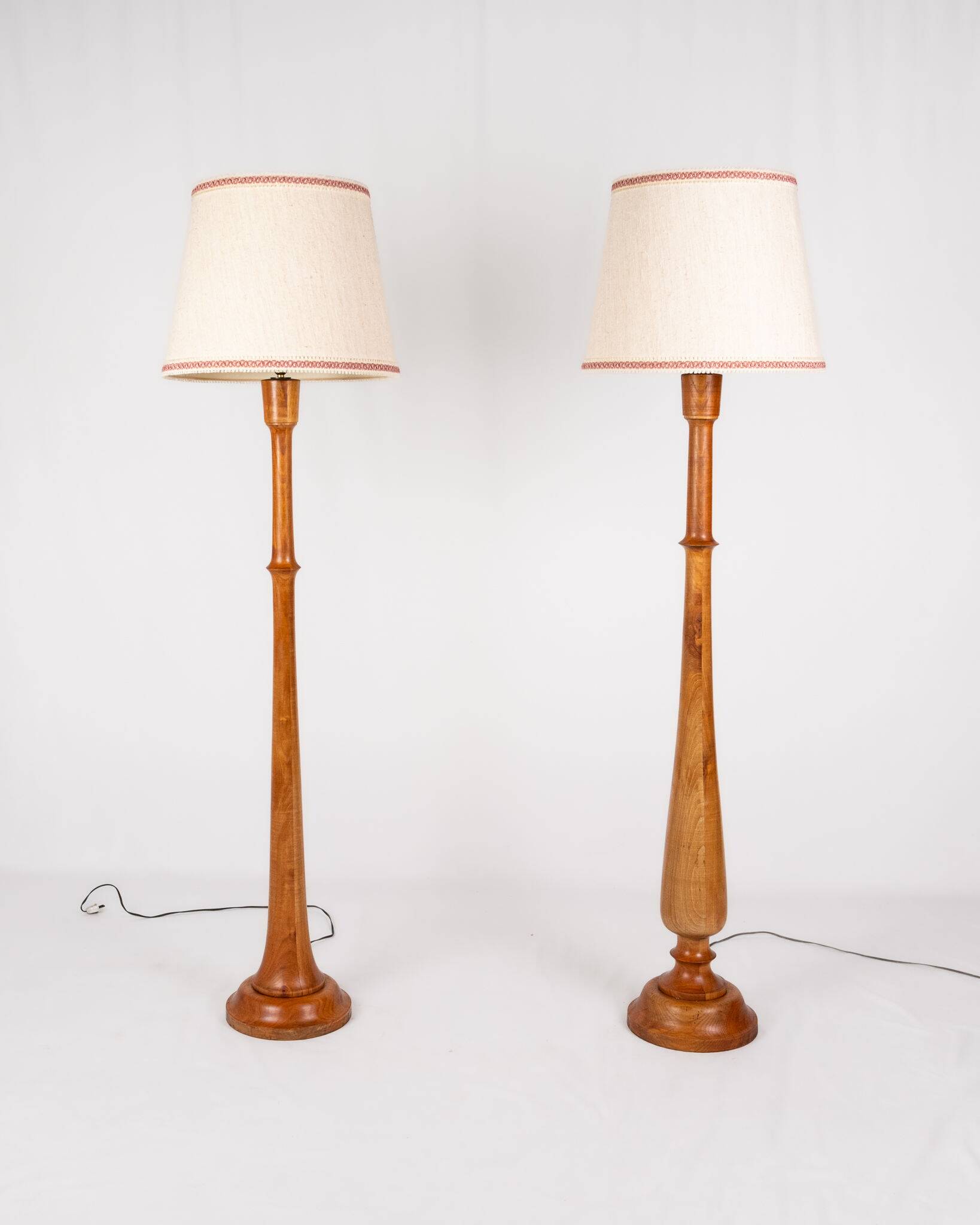 Pair of turned wooden floor lamps in Art Deco style, France, mid-20th century.