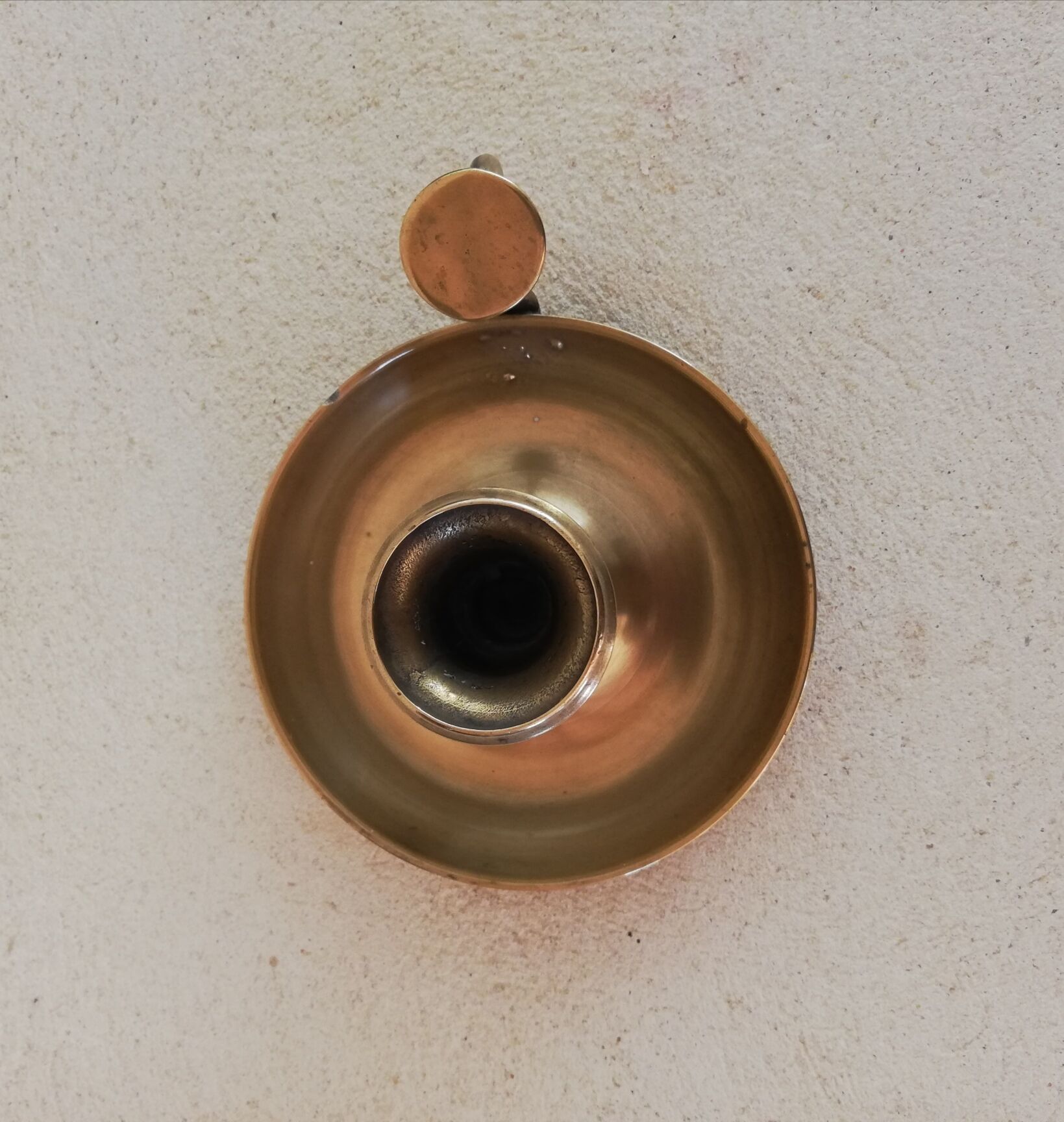 Brass hand candle holder