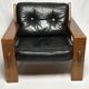 Black leather and wood armchair by Esko Pajamies, 1960s, Finland.