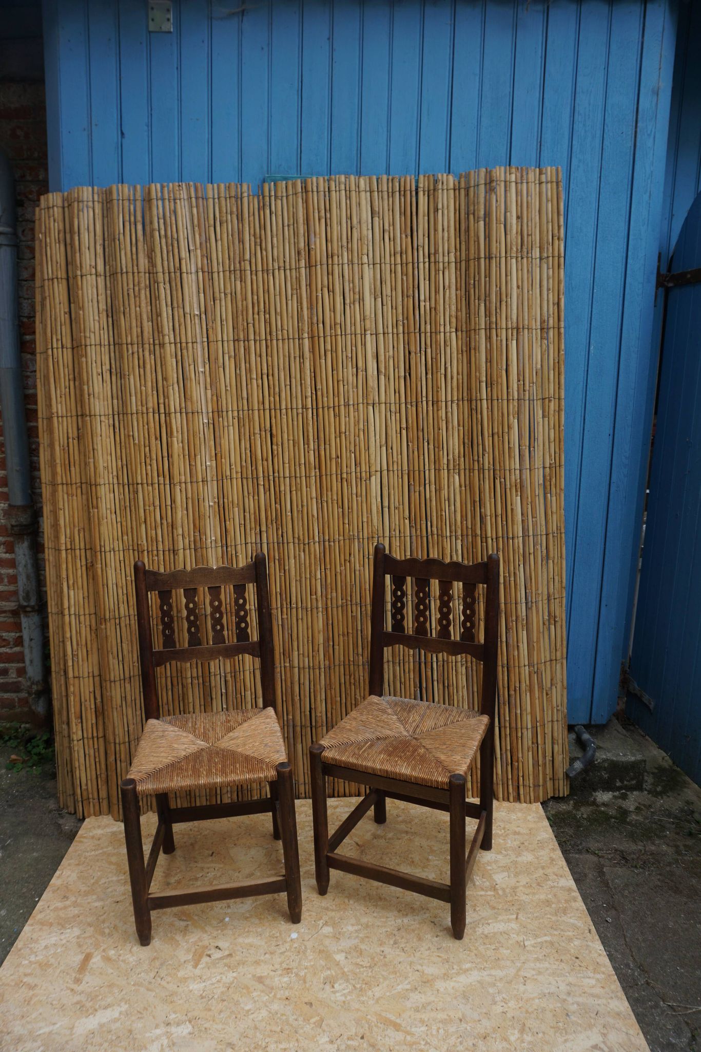 Pair of antique straw-seated farm chairs