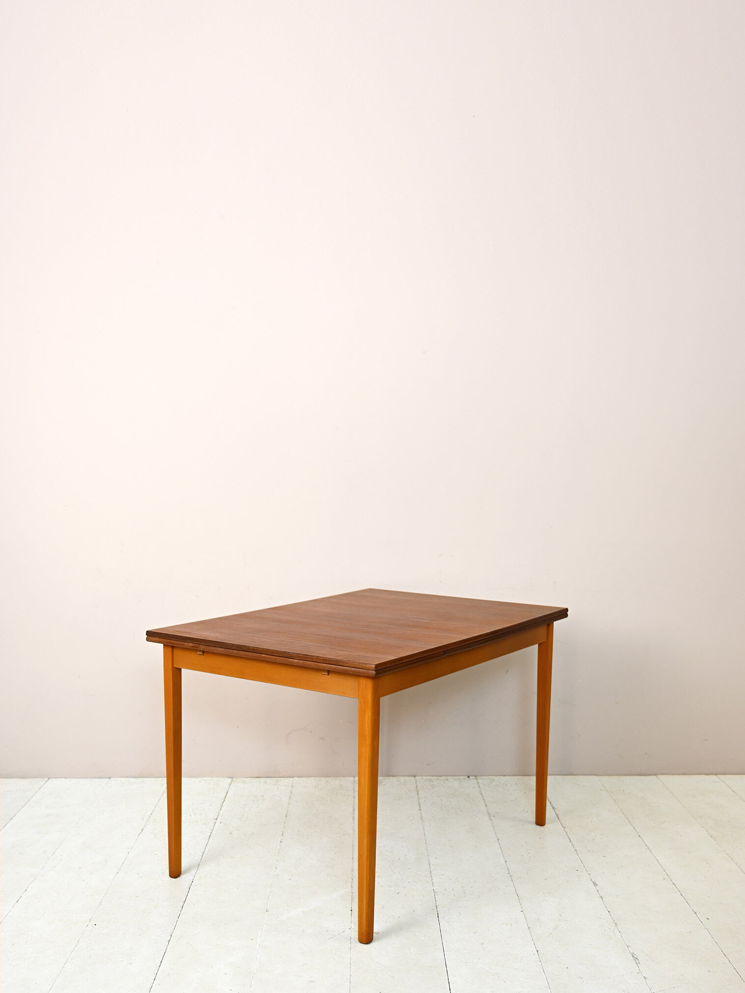 Scandinavian table with sliding panels.