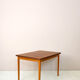 Scandinavian table with sliding panels.