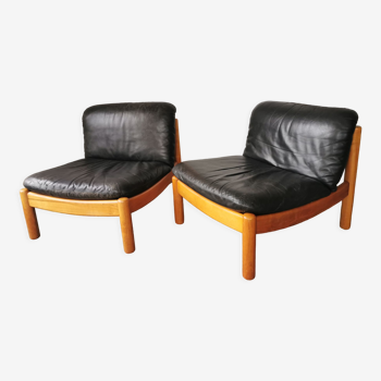 Pair of designer leather armchairs 80s