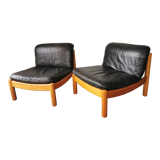 Pair of designer leather armchairs 80s